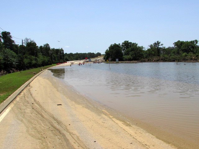 TxDOT: Water on FM 2499 in Flower Mound slowly going down