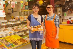 Faith Ko and Rachel Shim make donuts and memories daily for loyal customers at Sara Donuts in Flower Mound (Photo by Helen’s Photography).