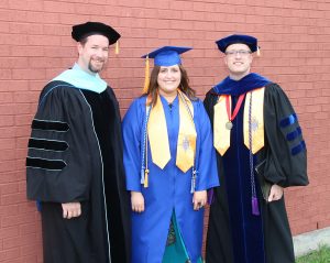 NCTC Honors Program student Jenna Stembridge (center) is pictured with NCTC Vice-President of Instructor Dr. Andrew Fisher (left) and NCTC President Dr. Brent Wallace before the Spring 2015 Graduation ceremony. Stembridge will attend Texas Tech University this fall (Photo Courtesy: NCTC)