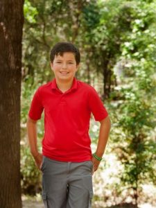 CJ McCue, 10, of Argyle has been dealing with the effects of West Nile Virus since he was first infected three years ago (Photo Credit: Helen's Photography).