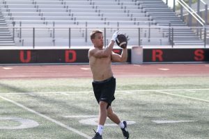 Jake Nelson catches a pass during Marcus football summer workouts on July 29. 