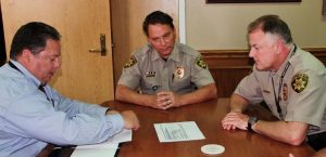 Sheriff Will Travis and chief deputy Rex George accept DEA funds for drug investigation (Photo Courtesy: DCSO).