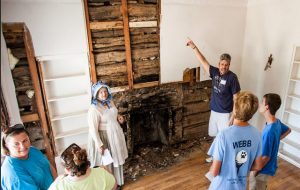 An estimated 2,300 people viewed history close up in Flower Mound on Aug. 15 at the site of a 1860s-era log cabin open to the public for the first time. Photo by Zero Drift Media/Bob VanOrden