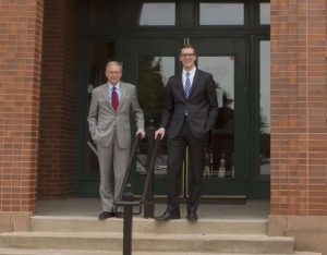 Charles Claunch, assistant headmaster, and Sam Vanderplas, headmaster, in front of Founders Classical Academy of Flower Mound in Parker Square (Photo Credit: Helen's Photography). 