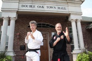 Double Oak residents Phil Miller and Gary Jordan offer free self-defense lessons each week at Double Oak Town Hall.