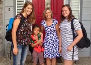 Foreign exchange students Claudia Ceddia (left) and Linde de Koning (right) with host Sue Warriner and grandson, Brayden Sanders.