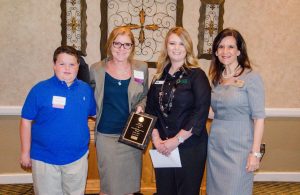 McAuliffe Elementary Principal  Jennifer Mattingly (second from left) accepted the award for the Flower Mound Chamber of Commerce's October School of the Month. 