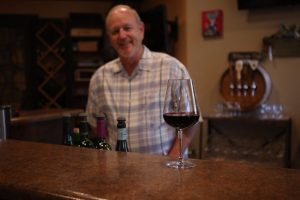 Dan Adams pours his heart into his business, Grapes to Wine in Bartonville Town Center near Lantana. (Photo by Foust Photography)