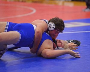 Flower Mound’s Daryl Rutherford takes the competition to the mat.