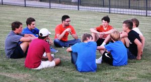 Boys gather with their leader to discuss real-life issues in their SOAK group.