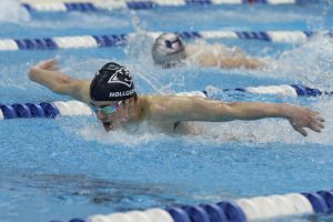 Garrett Holcroft of Flower Mound High School doing the 100 butterfly.