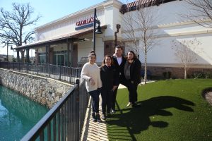 A family that serves together: Gloria and Jose Fuentes (center) with daughters Nancy (left) and Glenda, run the chain of Gloria’s Restaurants. (Photo by Foust Photography)