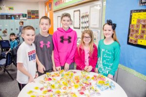 Heritage Elementary fifth graders sell candy grams and write letters to benefit Red Oak tornado victims.