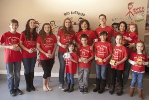 Serving the community are: Nate, Sophia, Olivia, Lara Lopez, Barbara Livermore, Jake, Mary Claire, Lyndsay, Ava, Grayson, Mia, Addie, and Mallery. (Photo by Helen’s Photography)