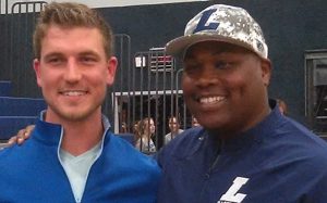 Carson Blair with Liberty Head Varsity Baseball Coach Johnny Isom on Media Day.