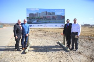 Pictured, left to right, with the rendering of Flower Mound’s first hotel, The Courtyard by Marriott at the River Walk: New Era’s Scott Tarwater, president and CEO, with Tim Lavender, founder and principal; Vice President and Project Manager Brad McCafferty of New Era; and, Jay Fuquay of Trinity Private Equity Group. (Photo by Foust Photography)