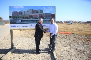 President and CEO Scott Tarwater, left, of New Era Partners with Jay Fuquay of Trinity Private Equity Group, the finance group for the Courtyard by Marriott at River Walk Hotel. (Photo by Foust Photography)