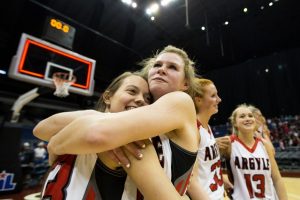 Seniors Olivia Gray and Kaylie King embrace their win over Liberty Hill 43-32 at the UIL State Basketball Semi-finals at Alamodome in San Antonio, TX on March 4, 2016. (Annabel Thorpe / The Talon News)