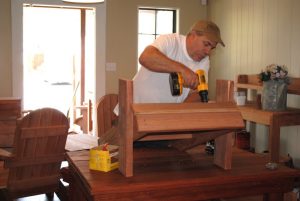Cal Pierce crafts handmade outdoor furniture at The Redwood Patio in Keller.