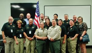 Volunteers in Police Services class members (front row, left to right): Bill Wood, Trish Wood, Tony Taliercio, Penny Campbell, Christina Wong, Charley Smith, Sandy Dutton and Cynthia Carmack. Back row, left to right): Brandon Harris, Rex Allen, Sheriff, Jill Mize, Steve Wong, Jerrold Mooney, George Campbell and Hannah Nestor.