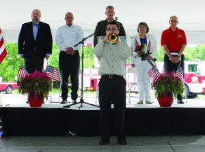 Trumpeter Iver Sneva plays “Taps” at the Flower Mound Memorial Day event. Standing behind him are (left to right) Mayor Pro Tem Kevin Bryant, Flower Mound Council Member Bryan Webb, Lt. Colonel Paul T. Patrick, and Flower Mound Fire Department Chaplain Russ McNamer. Photo by Dru Murray.