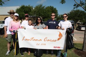 Lantana Cares volunteers Mark Lott, Jessica Lott, Anna Horvath, Brenda Horvath, Christian Keller, Bill Featherstone and Christy Wong clean up the Lantana Green.