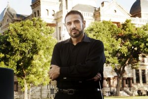 Native Texan Dr. Arturo Ortega leads many voices from the community as conductor of the Voices of Flower Mound. (Photo by Helen’s Photography)