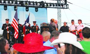 Members of the Flower Mound Fire Department prepare to lead the large, enthusiastic crowd in singing the national anthem. Photo by Dru Murray.