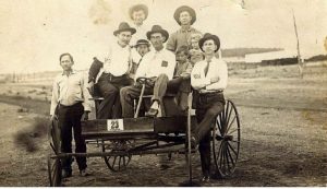 The owner of the log cabin house on West Front Street in Argyle, Tom Wingo (pictured with pipe), Bill Carpenter (boy wearing hat), his brother Arthur and little sister Winifred. (Courtesy Photo: Jackie Carpenter)