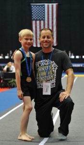 Micah Terrill and Win Kids coach Jack Lee.