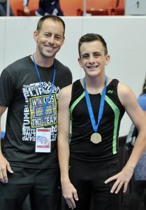 Win Kids coach Jack Lee and trampoline champ Quinn Maguire.