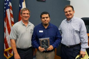 At Monday’s Town Council meeting, Mayor Tom Hayden, alongside Environmental Health Manager Tom Vyles (left), presented a representative from Autumn Leaves with their Food Safety Excellence Award. (Photo courtesy: Town of Flower Mound)