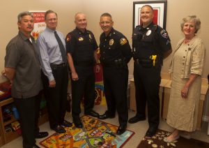 Youth and Family Counseling Board members Eric Diaz, Michael Walker and Lewisville Assistant Police Chief Kevin Deaver with Flower Mound Police Chief Andy Kancel, Highland Village Police School Resource Officer David Harney and Karen Martin, Youth and Family Counseling Interim Executive Director. (Photo by Helen’s Photography)