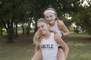 Lanie Rodgers and Rhyle McKinney are making tracks at Argyle High School this year in the sport of distance running. (Photo by Helen’s Photography)