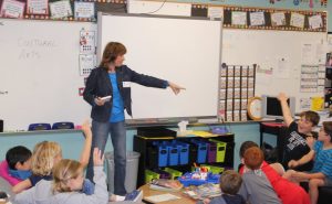 Annette Weir talking to third graders in Allison Smith's class on Career Day at Garden Ridge Elementary School in Flower Mound. 