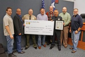 Sheriff Will Travis (second from left) and Flower Mound Police Chief Andy Kancel (third from right) with Flower Mound Town Council members.