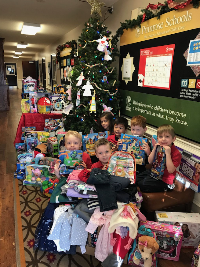 Local Primrose Schools deliver large donation to CCA’s gift drive