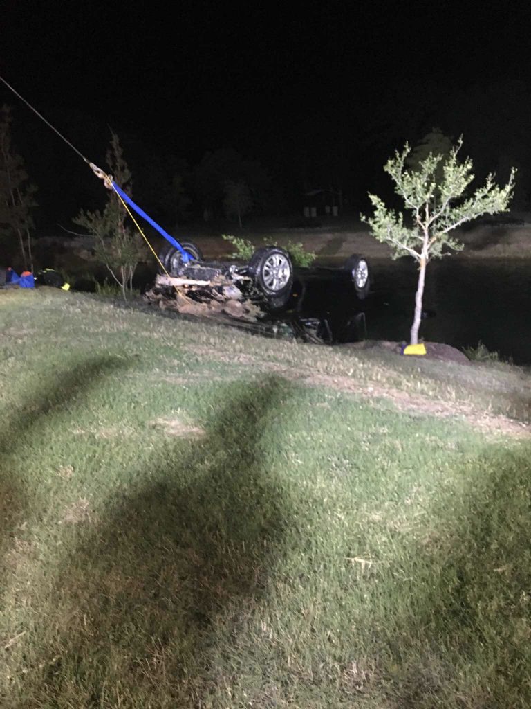 Car drives into the water near Flower Mound River Walk