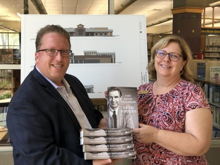 Local real estate broker promotes being a ‘Good Neighbor’ with library donation