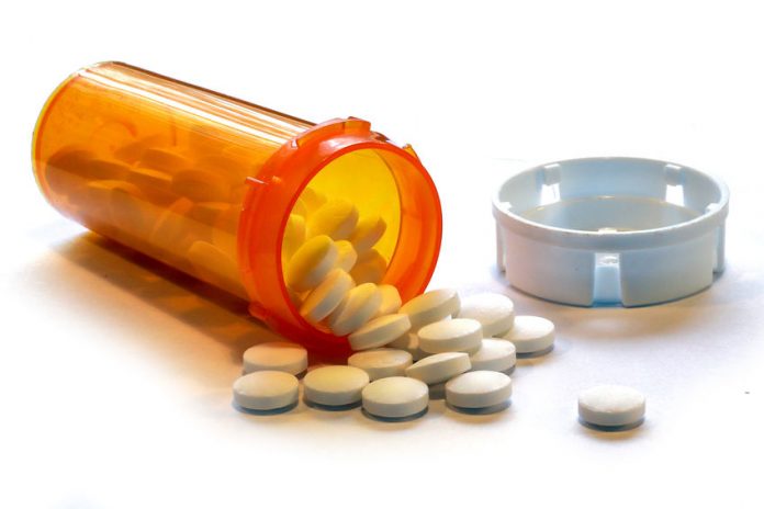 Opioid Crisis - Open Bottle of Prescription Painkiller Pills