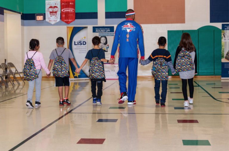 Local business, Globetrotters host assembly at Flower Mound elementary school