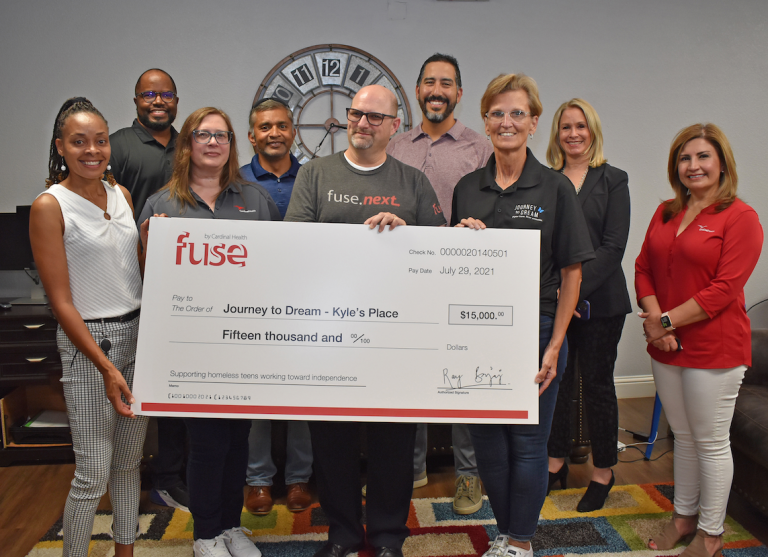 Local business delivers $15k donation to support homeless teens