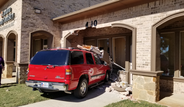 Vehicle hits building on FM 407