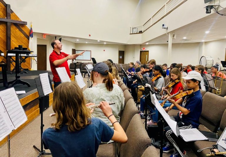 Local music director survives motorcycle accident to conduct end of the year concert