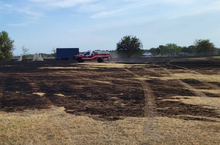 Firefighters knock down grass fire near church